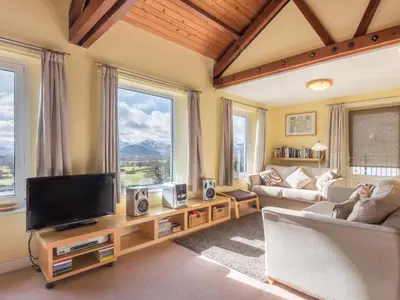 a living room with a flat screen tv and a couch at 3 Bed in Applethwaite SZ540 in Applethwaite