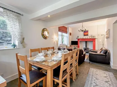 a dining room and living room with a table and chairs at 4 Bed in Keswick SZ292 in Keswick