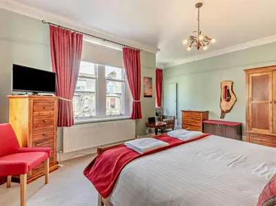 a bedroom with a large bed and a television at 4 Bed in Keswick SZ292 in Keswick