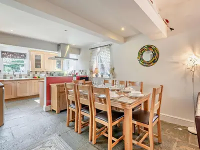 a kitchen and dining room with a wooden table and chairs at 4 Bed in Keswick SZ292 in Keswick