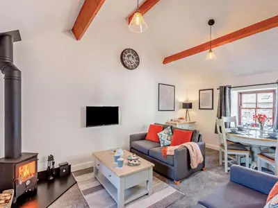 a living room with a couch and a table at 2 Bed in Keswick oc-sz449 in Keswick