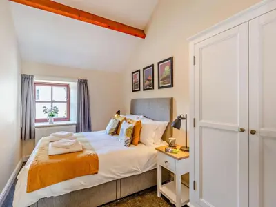 a bedroom with a bed and a window at 2 Bed in Keswick oc-sz449 in Keswick