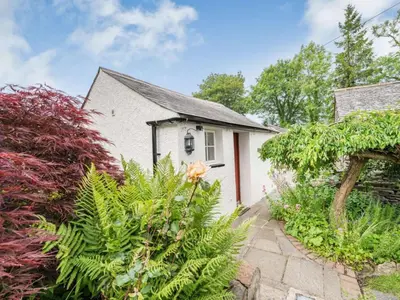 a white house with a red door and some plants at 4 Bed in Routenbeck SZ405 in Bassenthwaite Lake
