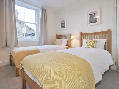 two beds in a bedroom with a window at 4 Bed in Keswick oc-sz443 in Keswick