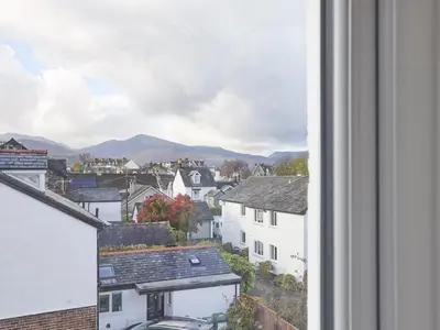 a view of a city with buildings and mountains at 4 Bed in Keswick oc-sz443 in Keswick