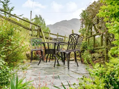 a table and chairs sitting on a patio at 2 Bed in Borrowdale SZ302 in Rosthwaite