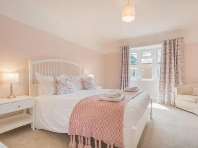 a bedroom with a white bed and a window at 3 Bed in Keswick oc-sz283 in Keswick
