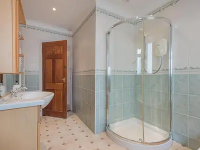 a bathroom with a shower and a sink at 3 Bed in Keswick oc-sz283 in Keswick