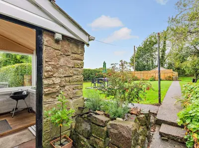 a stone house with a garden in the backyard at 2 Bed in Wasdale oc-sz077 in Santon Bridge