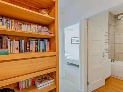 a room with a book shelf filled with books at 1 Bed in Lorton SZ160 in Lorton