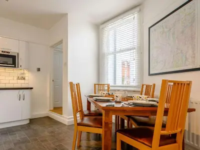 a dining room with a wooden table and chairs at 3 Bed in Keswick oc-sz118 in Keswick