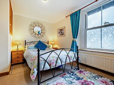 a bedroom with a bed and a window at 2 Bed in Keswick oc-sz417 in Keswick