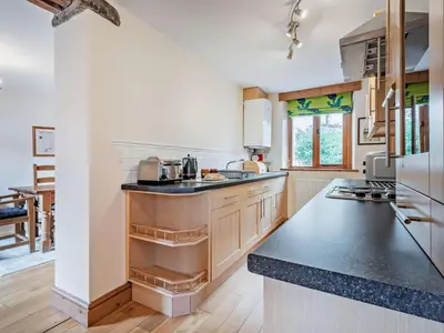 a large kitchen with a black counter top at 3 Bed in Keswick oc-sz153 in Braithwaite