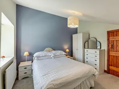 a bedroom with a large bed and two night stands at 2 Bed in Keswick oc-sz145 in Braithwaite