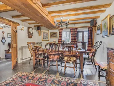a dining room with a table and chairs at 5 Bed in Holmrook oc-sz259 in Eskdale