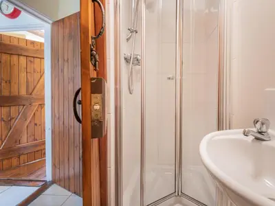 a bathroom with a shower and a sink at 2 Bed in Keswick oc-sz378 in Portinscale