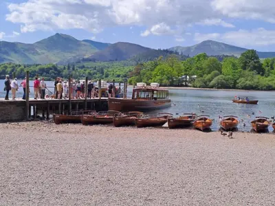 a group of boats on the shore of a lake at 1 Bed in Keswick SZ127 in Keswick