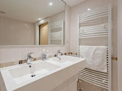 a bathroom with a white sink and a mirror at 1 Bed in Keswick SZ127 in Keswick