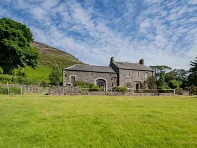 an old stone house in a field of grass at 2 Bed in Penrith oc-sz092 in Mosedale