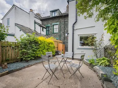 a table and chairs in the backyard of a house at 3 Bed in Keswick oc-sz029 in Keswick