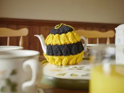 a crocheted tea pot sitting on a table at 2 Bed in Wasdale Head oc-sz551 in Nether Wasdale