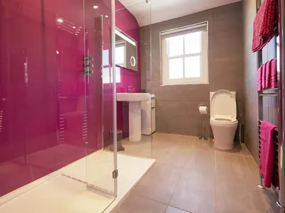 a bathroom with a toilet and a glass shower at 2 Bed in Keswick SZ011 in Keswick