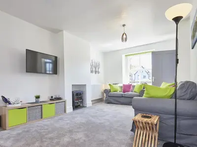 a living room with a couch and a tv at 2 Bed in Keswick SZ011 in Keswick