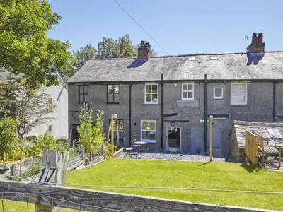 a large house with a yard in front of it at 2 Bed in Keswick SZ011 in Keswick