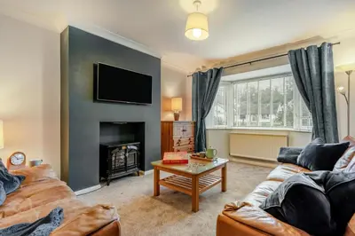 a living room with a couch and a fireplace at 3 Bed in Keswick oc-84638 in Keswick