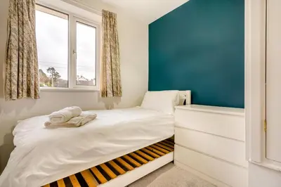 a small bedroom with a bed and a window at 3 Bed in Keswick oc-84638 in Keswick