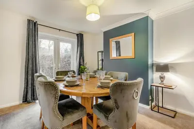 a dining room with a wooden table and chairs at 3 Bed in Keswick oc-84638 in Keswick