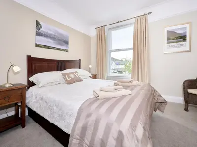 a bedroom with a bed and a window at 4 Bed in Keswick oc-sz220 in Keswick