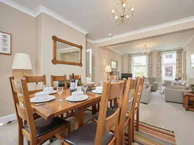 a dining room and living room with a table and chairs at 4 Bed in Keswick oc-sz220 in Keswick