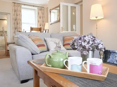 a living room with a couch and a coffee table at 4 Bed in Keswick oc-sz220 in Keswick