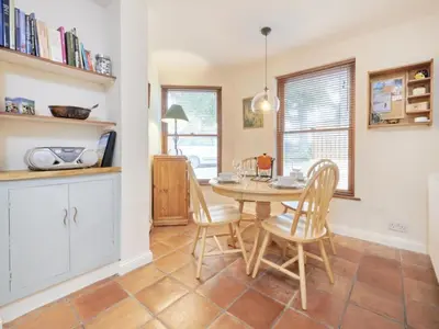 a kitchen and dining room with a table and chairs at 2 Bed in Keswick oc-sz279 in Keswick