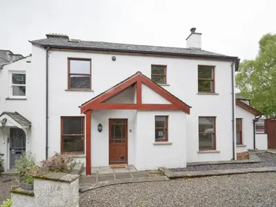 a white house with a red roof at 2 Bed in Keswick oc-sz279 in Keswick