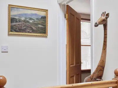 a giraffe head on the wall in a room at 2 Bed in Keswick oc-sz279 in Keswick