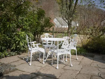 a white table and chairs sitting on a patio at 3 Bed in Keswick oc-sz533 in Braithwaite