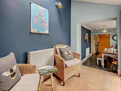 a living room with a couch and a chair at 4 Bed in Cockermouth oc-sz037 in Cockermouth