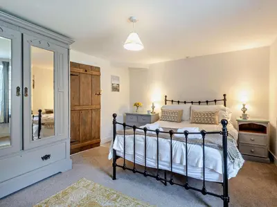 a bedroom with a bed and a walk in closet at 3 Bed in Braithwaite SZ174 in Braithwaite