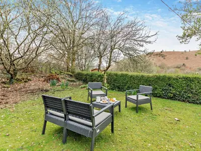 two benches and a table in the grass at 3 Bed in Braithwaite SZ174 in Braithwaite