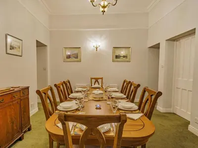 a dining room with a wooden table and chairs at 4 Bed in Ambleside oc-85294 in Grasmere