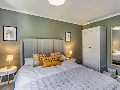 a bedroom with a large bed with pillows on it at 2 Bed in Keswick oc-87092 in Keswick