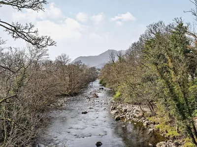 a river with snow and trees on the side at 2 Bed in Keswick oc-87092 in Keswick