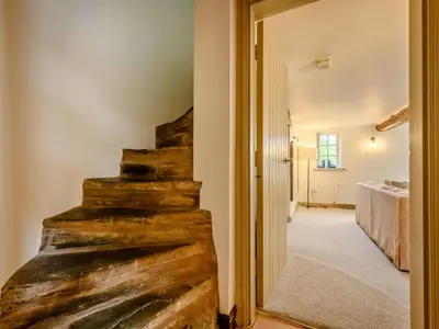 a hallway with a wooden staircase in a house at 3 Bed in Cockermouth oc-88773 in Buttermere
