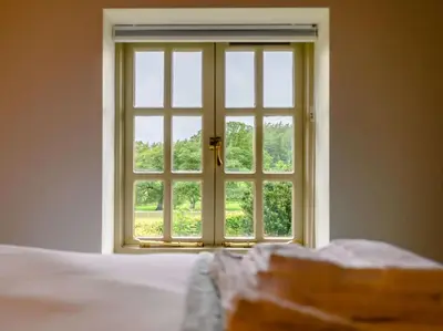 an open window in a bedroom with a bed at 3 Bed in Cockermouth oc-88773 in Buttermere
