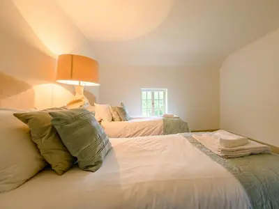 a bedroom with two beds and a window at 3 Bed in Cockermouth oc-88773 in Buttermere