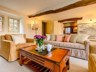 a living room with two couches and a coffee table at 3 Bed in Cockermouth oc-88773 in Buttermere