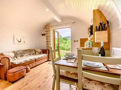 a living room with a couch and a table at 1 Bed in Ennerdale Bridge 88672 in Frizington