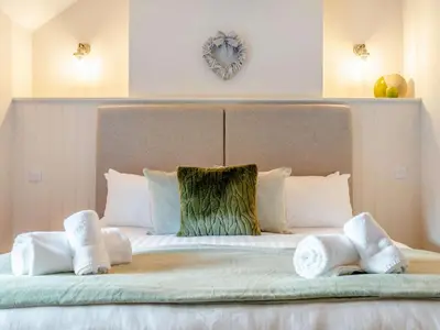 a bedroom with a bed with towels on it at 5 Bed in Wigton oc-89496 in Torpenhow